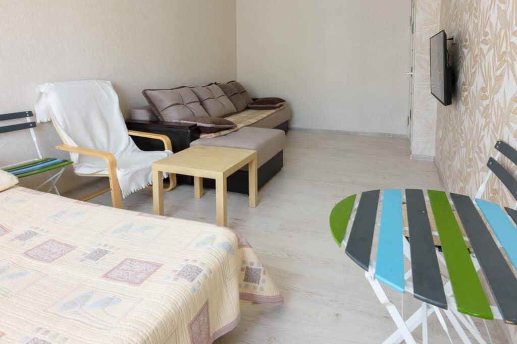 A studio flat with a few pieces of furniture