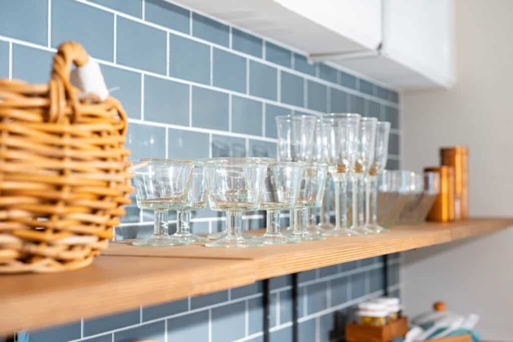 Breakable cups on the cupboard in the concept of 'How to Pack Fragile Items'.