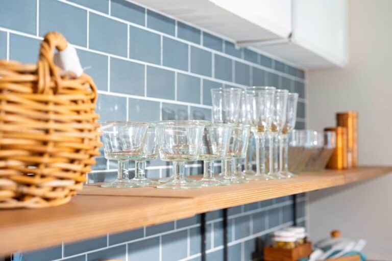 Breakable cups on the cupboard in the concept of 'How to Pack Fragile Items'.