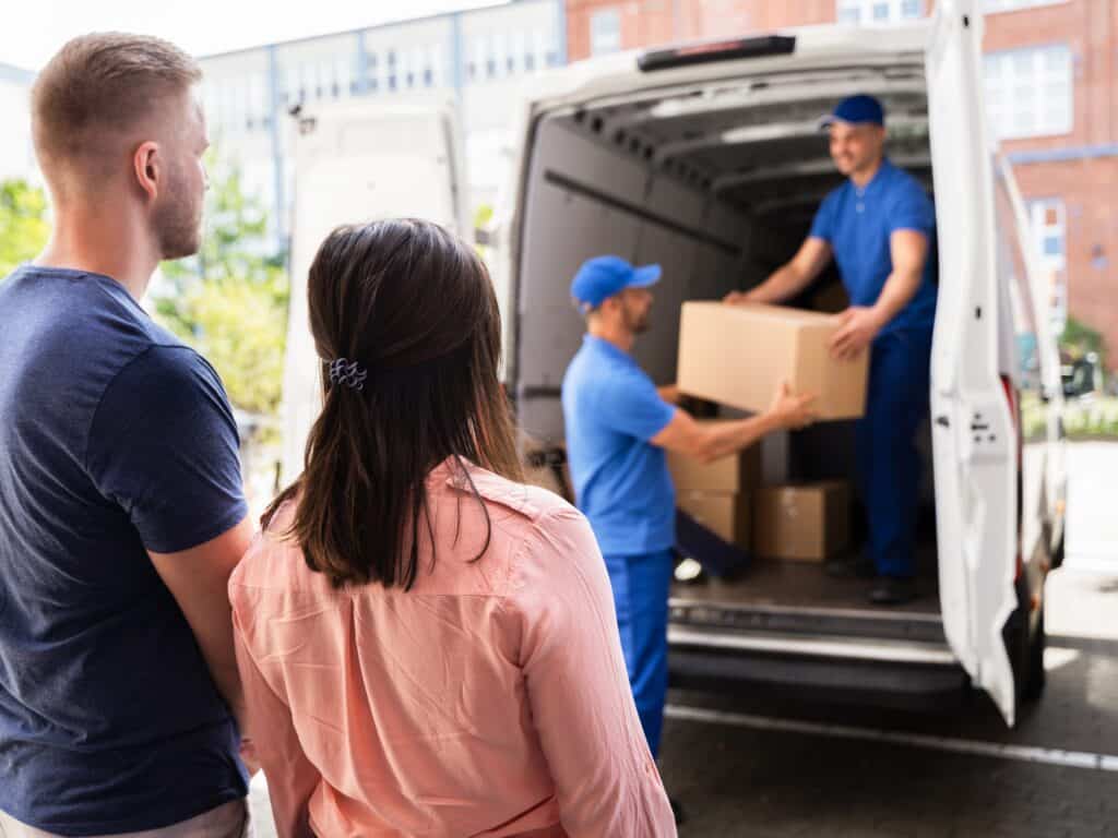 A couple with a man and van team during the house relocation