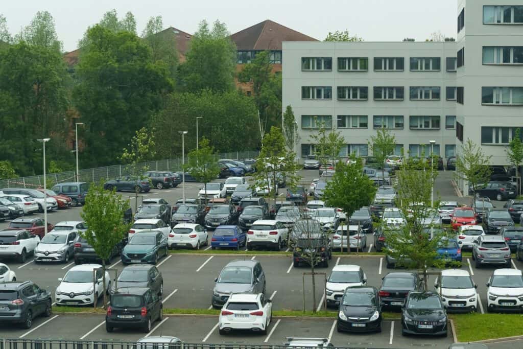 A huge parking space near an office building